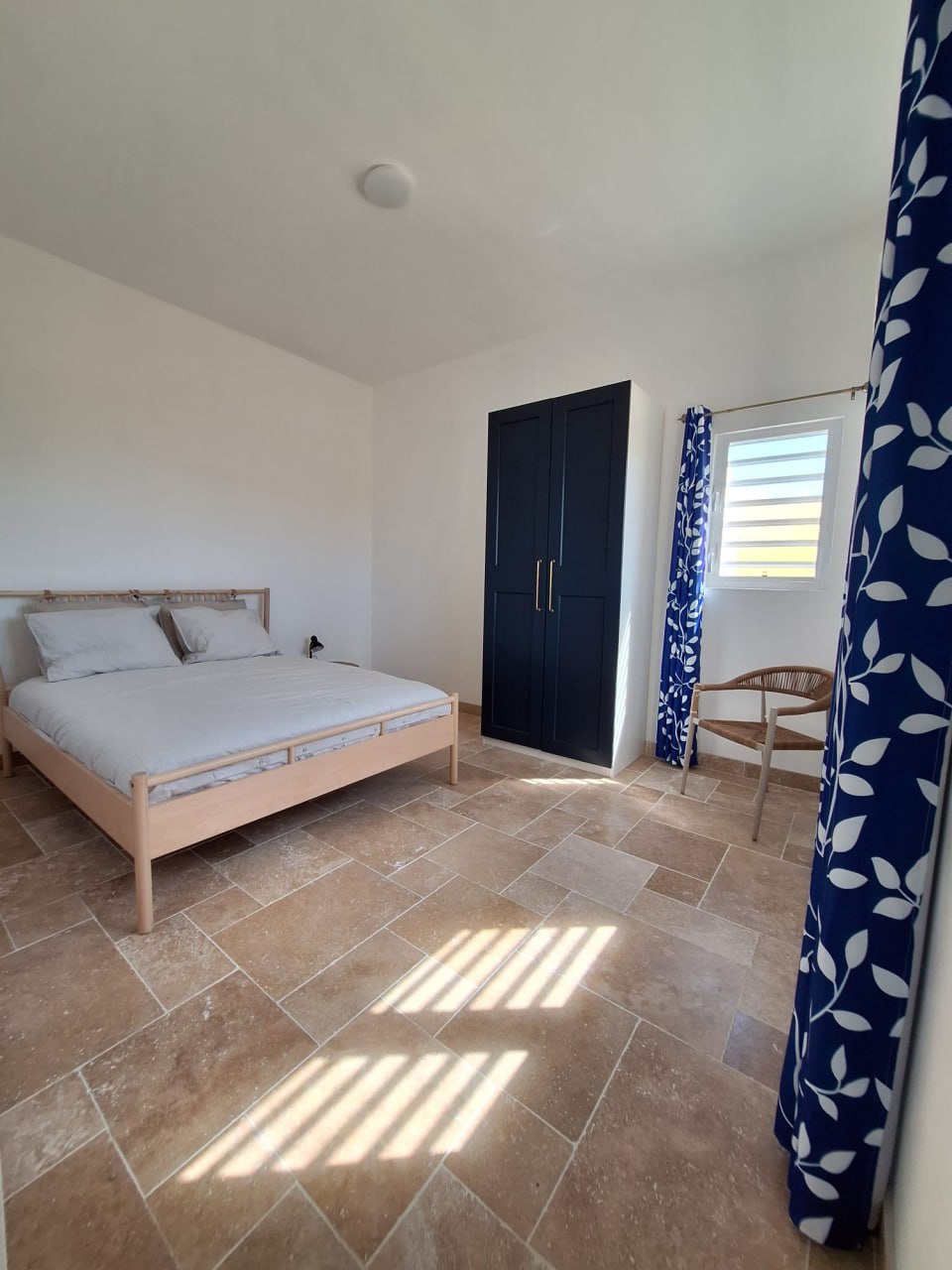 Bedroom with blue curtains
